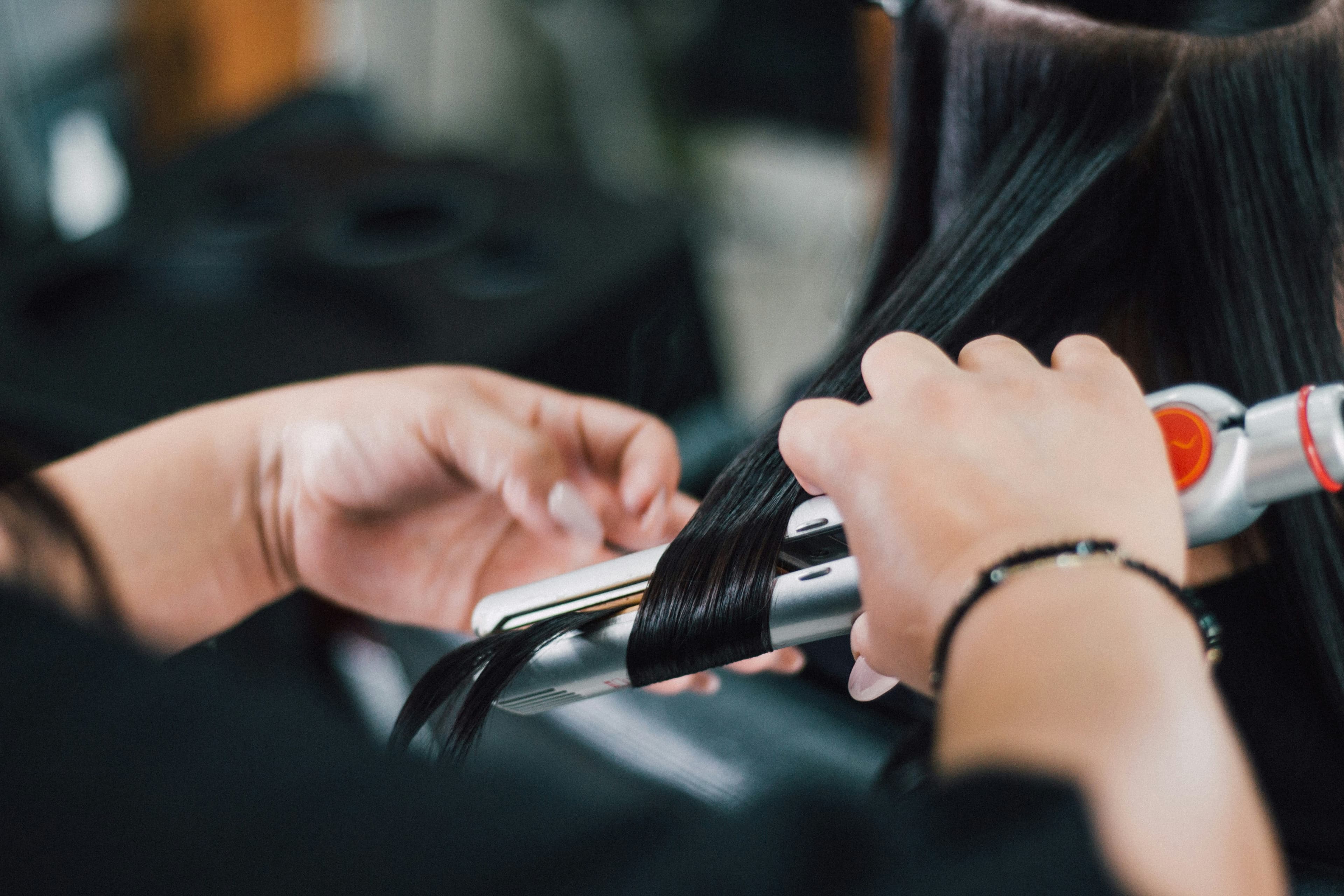 Stylist shaping a client's hair